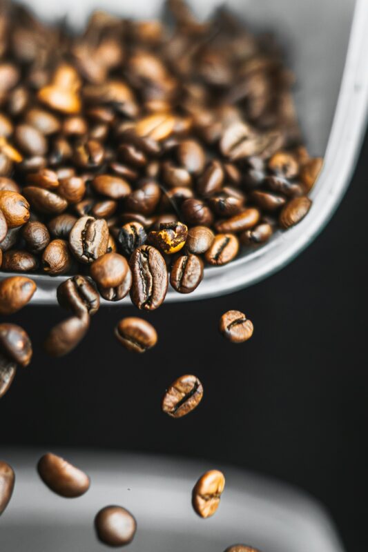 Roasted Ferrara coffee beans in a steel bowl